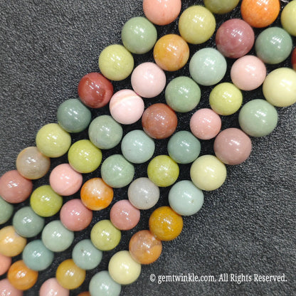 Parallel strands of smooth polished Alashan Gobi agate round loose beads for custom bracelet craft supply