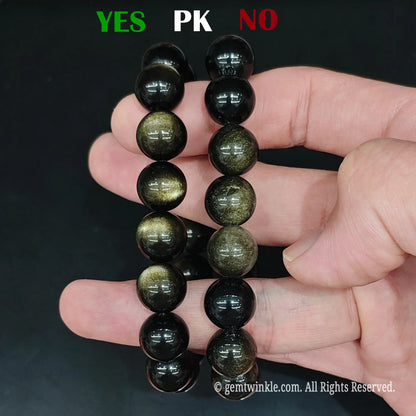 Natural gold obsidian beads quality comparison showing high sheen vs standard grade under studio light
