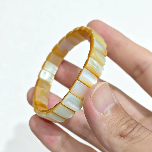 natural golden mother of pearl bar bracelet displaying golden honey yellow lip shell rectangular slabs and smooth polish
