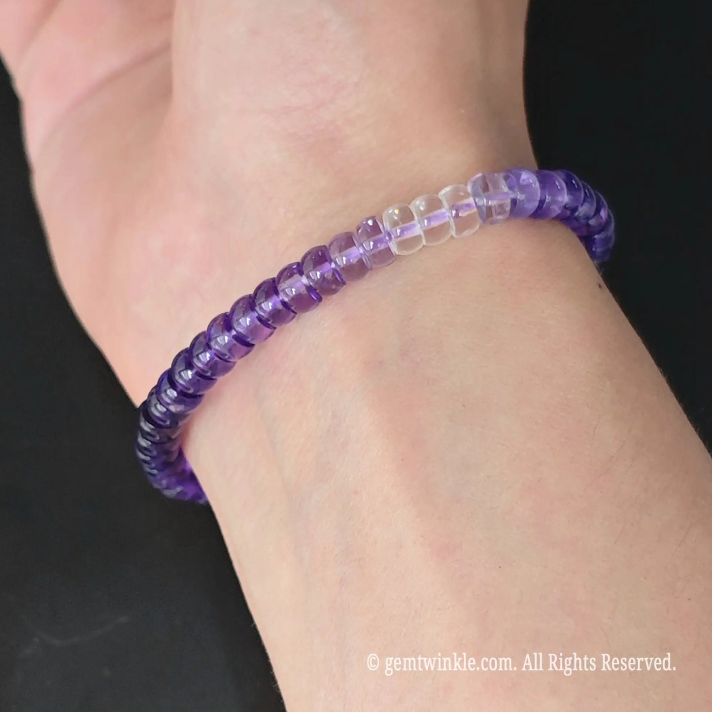 Full display view of natural gradient amethyst wheel bead stretch bracelet showcasing vibrant purple quartz clarity