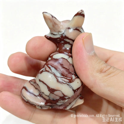 Rear view of natural jasper fox statue showing distinct wavy banding patterns across ears and back