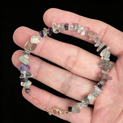 natural rainbow fluorite chip bracelet featuring purple green translucent nuggets and gold tone extender chain