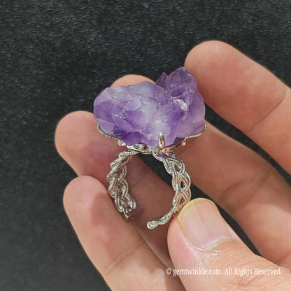 Natural raw amethyst point cluster ring showcasing the textured filigree alloy ring band and raw stone underside