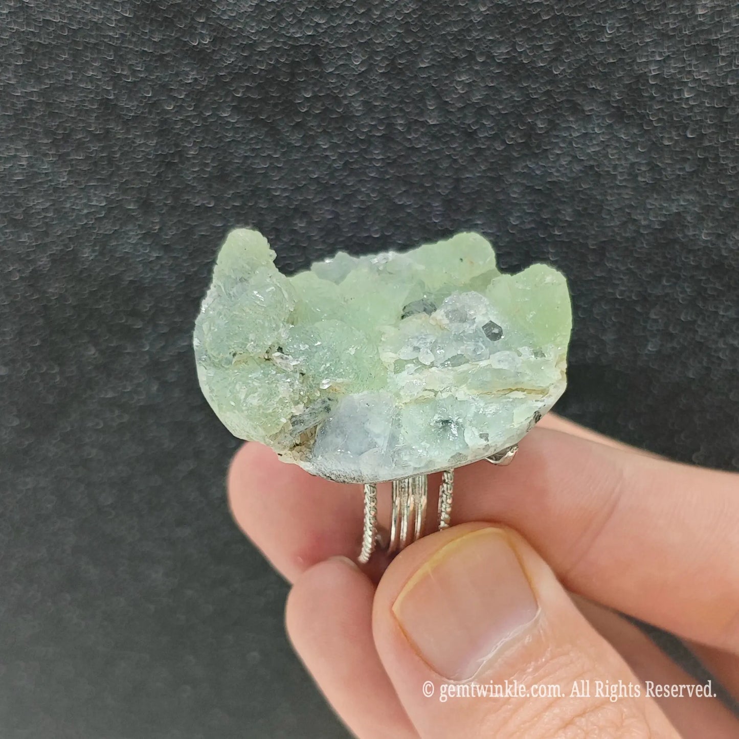 Natural raw fluorite cluster ring showcasing the textured adjustable alloy ring band and raw stone underside