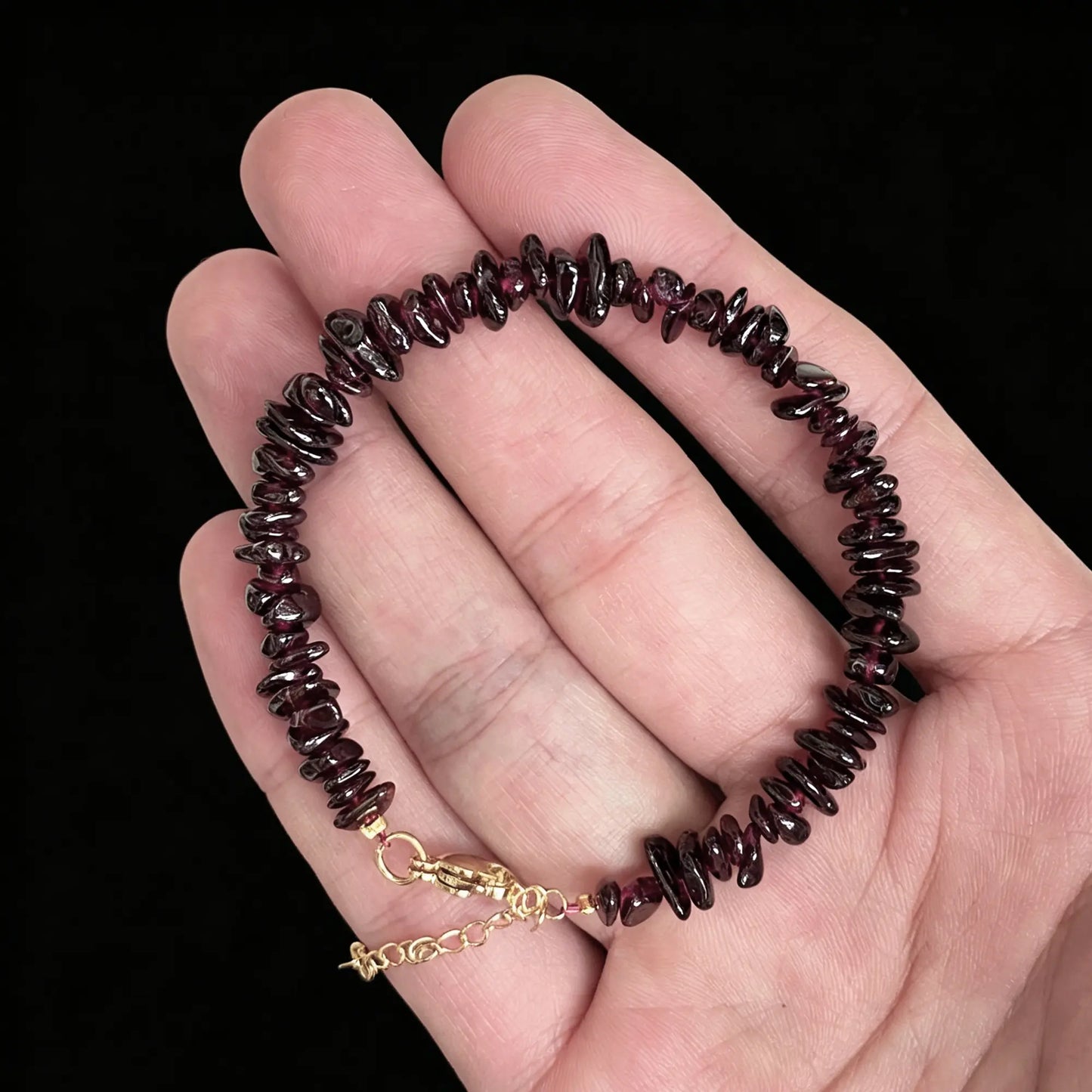 natural red garnet chip bracelet with dark wine red nuggets and gold tone extender chain