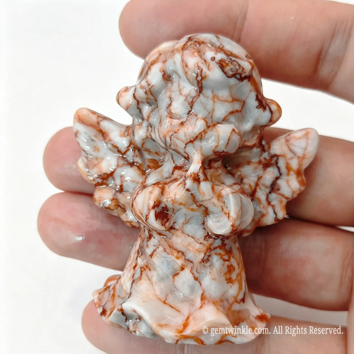 Single natural red network stone praying angel statue 6cm height held in hand displaying brown red vein patterns