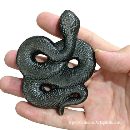 Frontal view of natural silver obsidian snake desk sculpture showing detailed body textures and silver sheen
