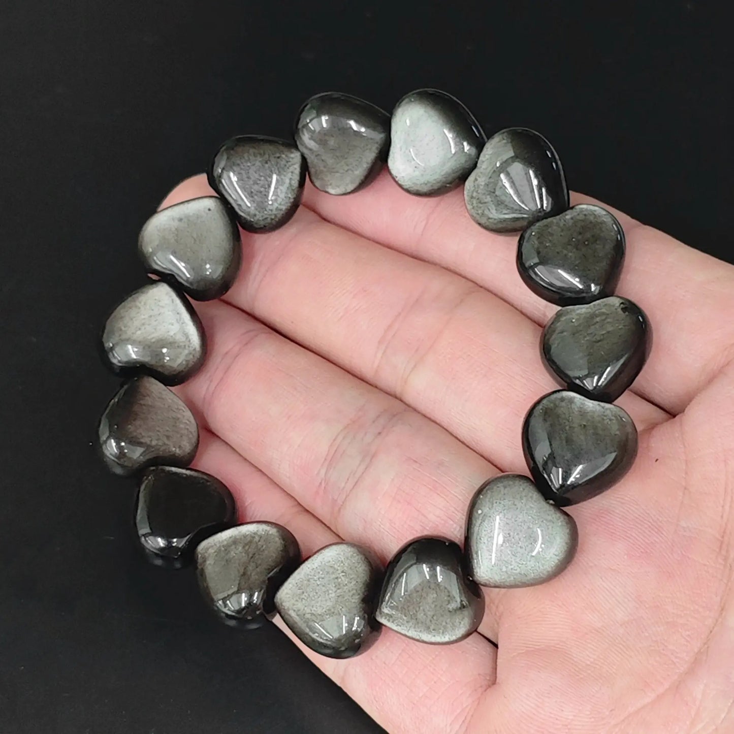 natural silver sheen obsidian heart bead bracelet hand display