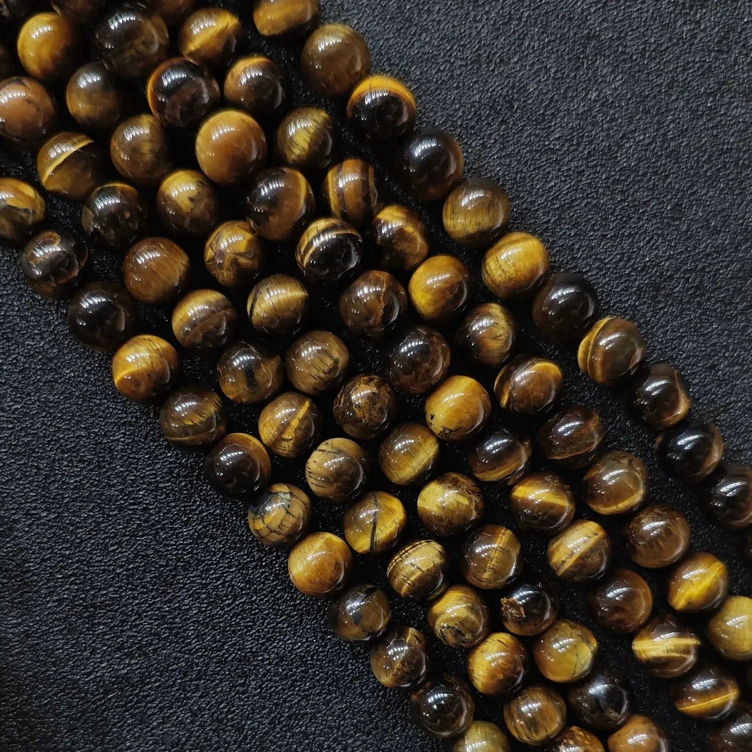 Natural budget grade b minus yellow tiger eye loose round beads strand with visible mineral clefts