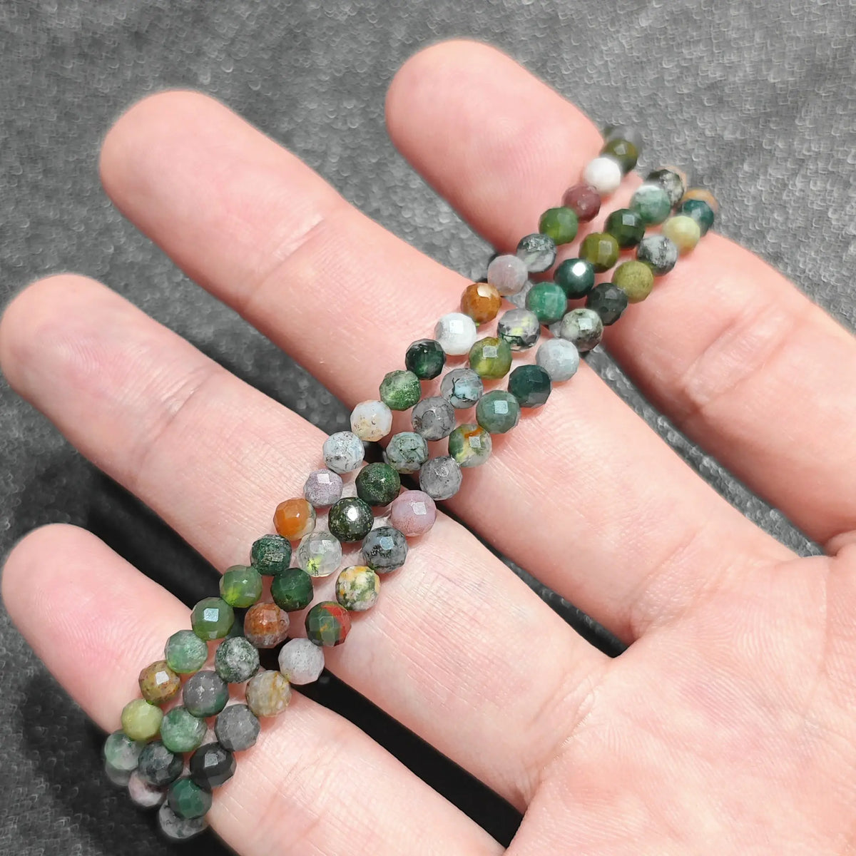 4mm ocean jasper micro faceted bead stretch bracelet held on hand for small batch boutique wholesale supply
