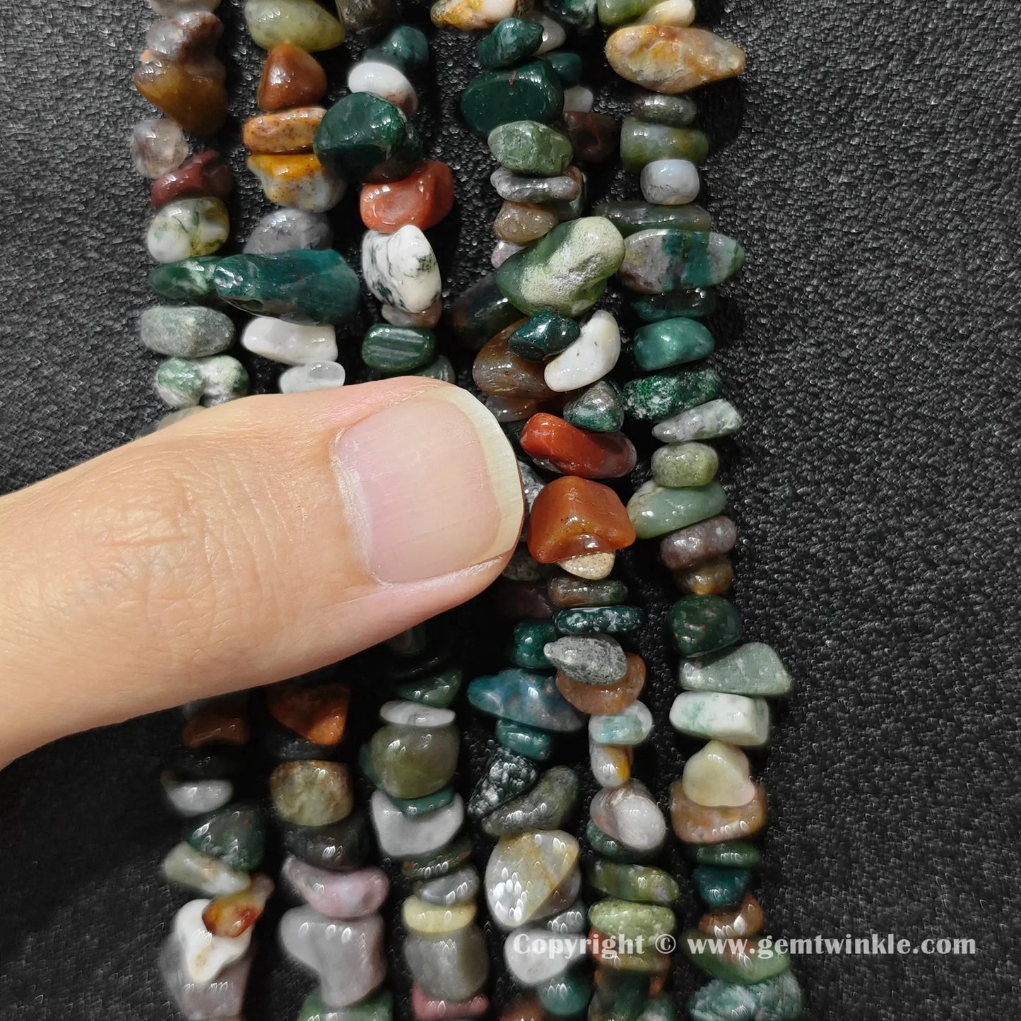 Close up view of natural ocean jasper chip beads demonstrating 80cm long strand yield