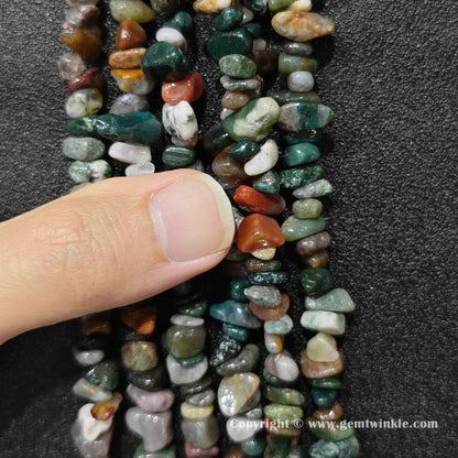 Close up view of natural ocean jasper chip beads demonstrating 80cm long strand yield