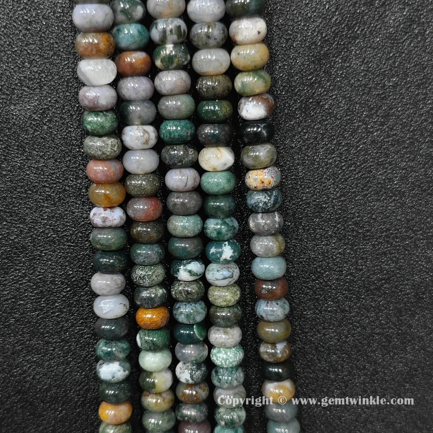 Perspective view of ocean jasper smooth heishi spacer beads showing uniform 6mm disc thickness