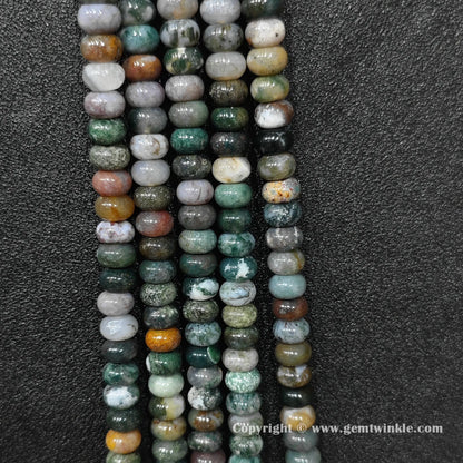 Perspective view of ocean jasper smooth heishi spacer beads showing uniform 6mm disc thickness