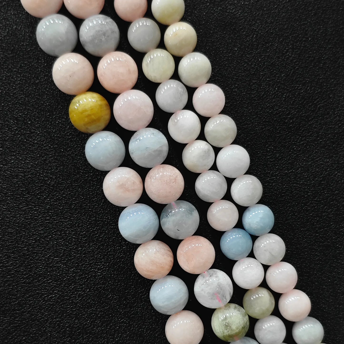 Close up view of opaque multi color morganite crystal beads strands in B-grade showing rich porcelain pastel pink and blue beryl minerals in image_cc95a3.jpg