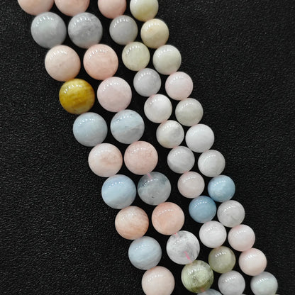 Close up view of opaque multi color morganite crystal beads strands in B-grade showing rich porcelain pastel pink and blue beryl minerals in image_cc95a3.jpg