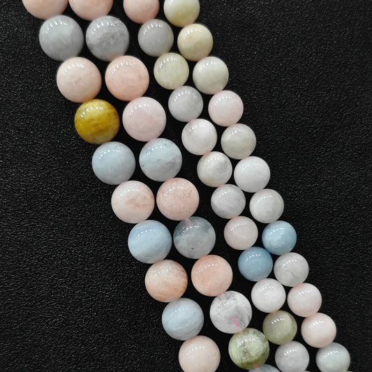 Close up view of opaque multi color morganite crystal beads strands in B-grade showing rich porcelain pastel pink and blue beryl minerals in image_cc95a3.jpg