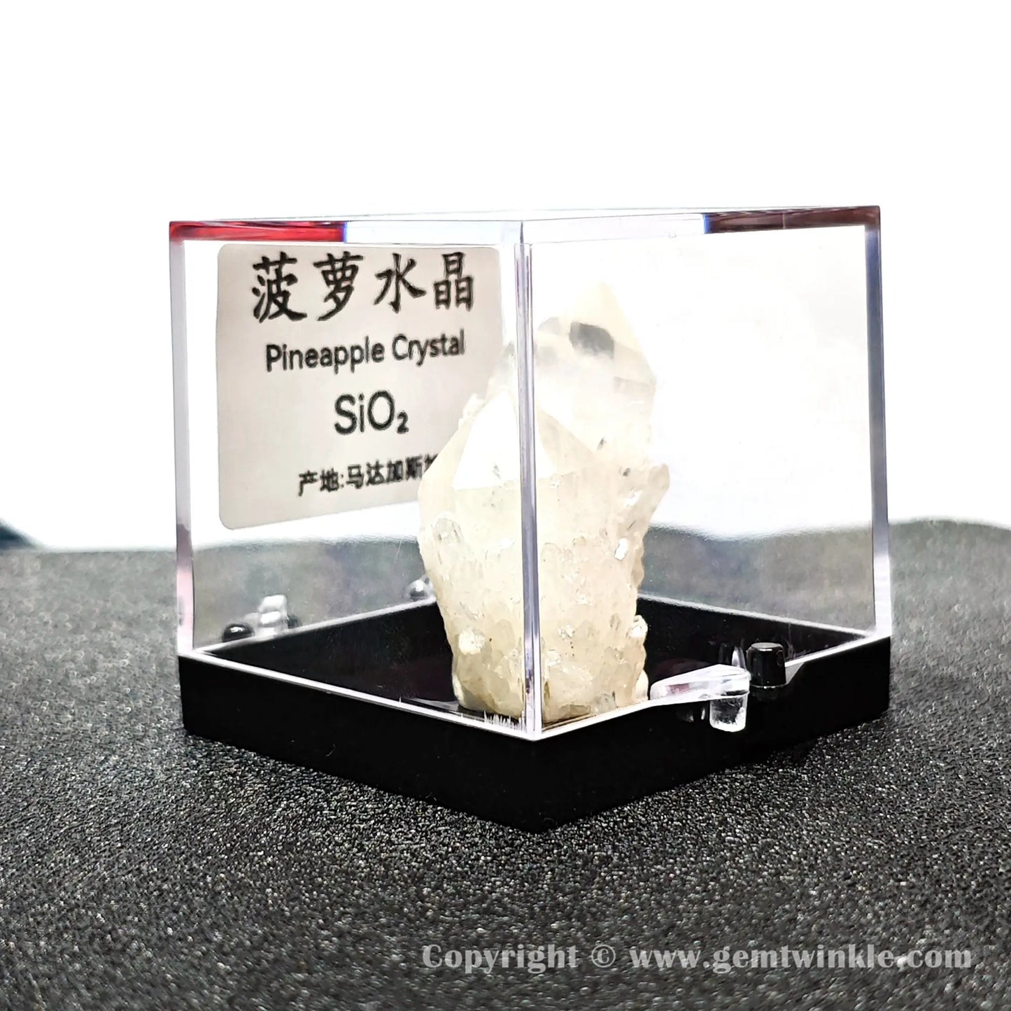 Right angled perspective showing rear milky quartz growth texture and secure black pedestal base mount