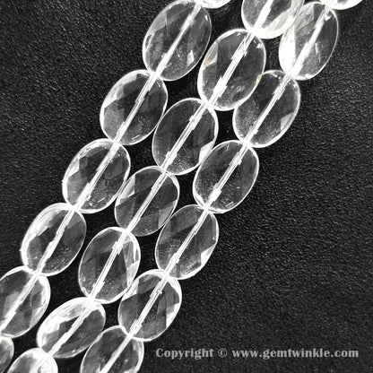 Close up view of faceted oval flat quartz beads highlighting light reflections