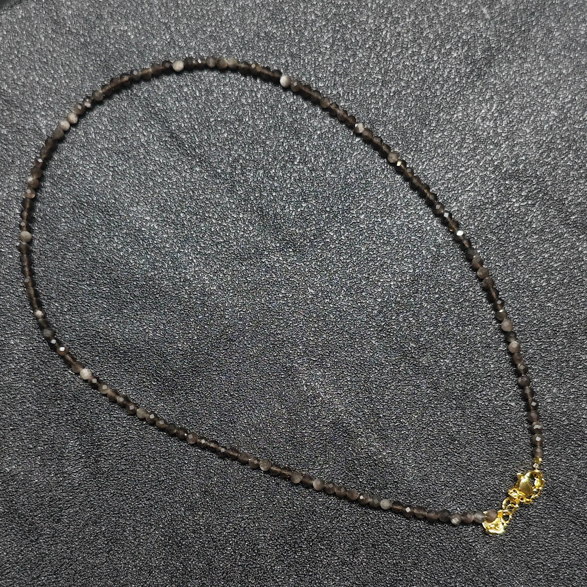 Wholesale silver sheen obsidian gemstone necklace featuring 3mm micro faceted beads and gold extension chain