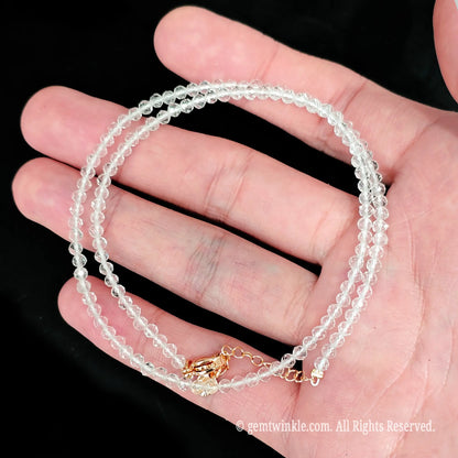 faceted pastel morganite micro bead necklace loop with gold tone extender chain in hand