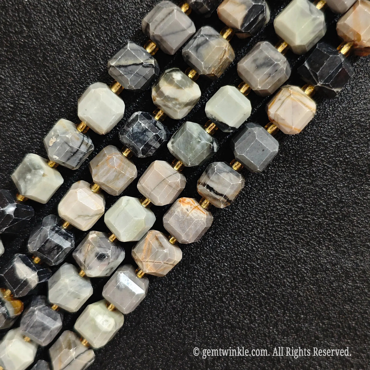 Close up view highlighting the abstract gray and black matrix lines of picasso jasper blocks