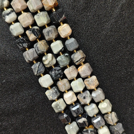 Multiple strands of natural picasso stone square beads arranged neatly for wholesale buyers