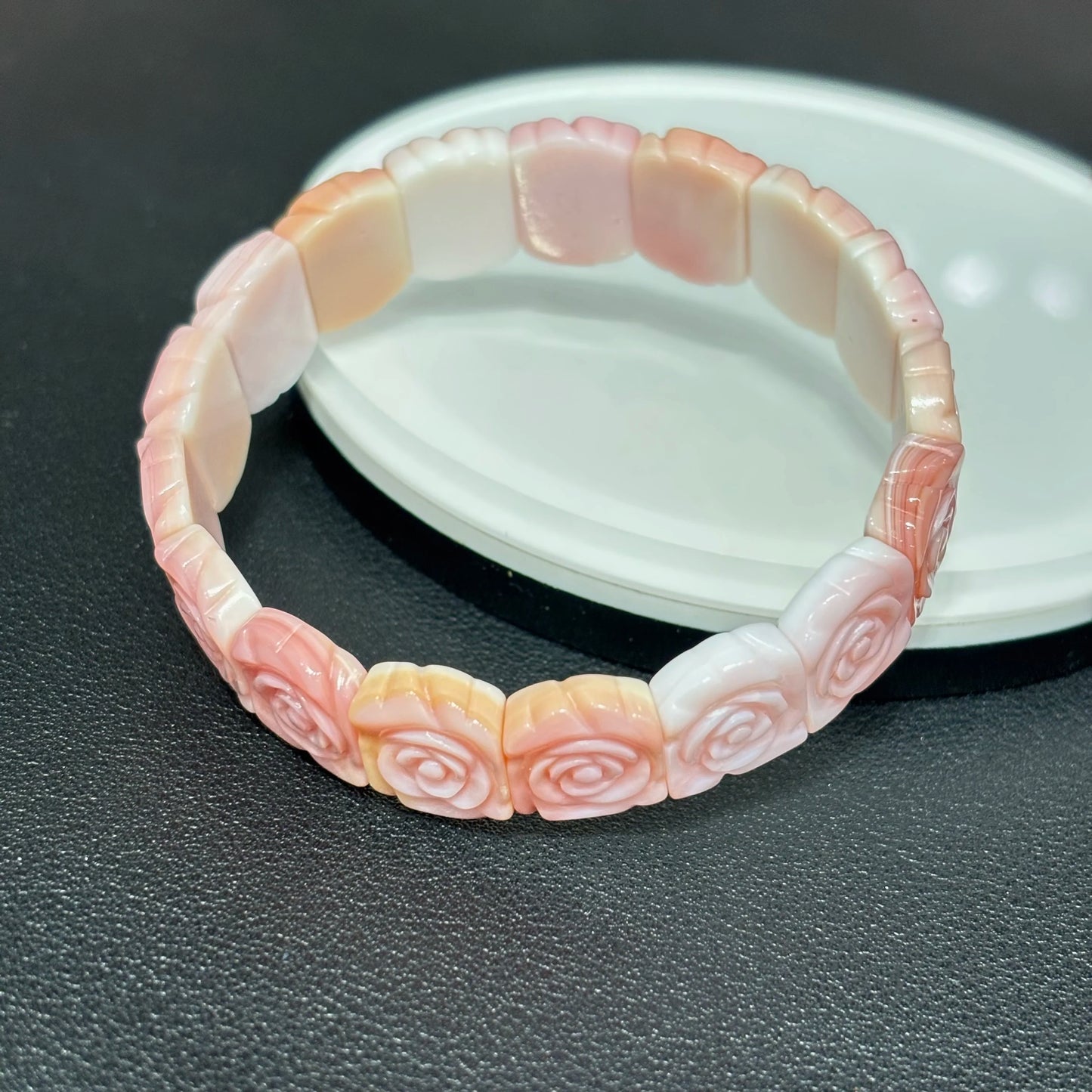 Pink Conch Shell Rose Bracelet on White Background