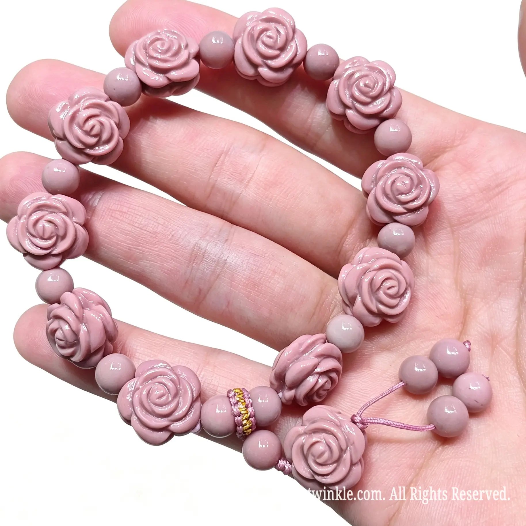 Full layout view of pink Alashan Gobi agate rose bracelet on hand showing natural matte luster