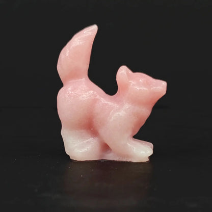 Side view of a 4cm pink opal puppy dog crystal carving with raised tail for low MOQ pet lover gift wholesale sourcing