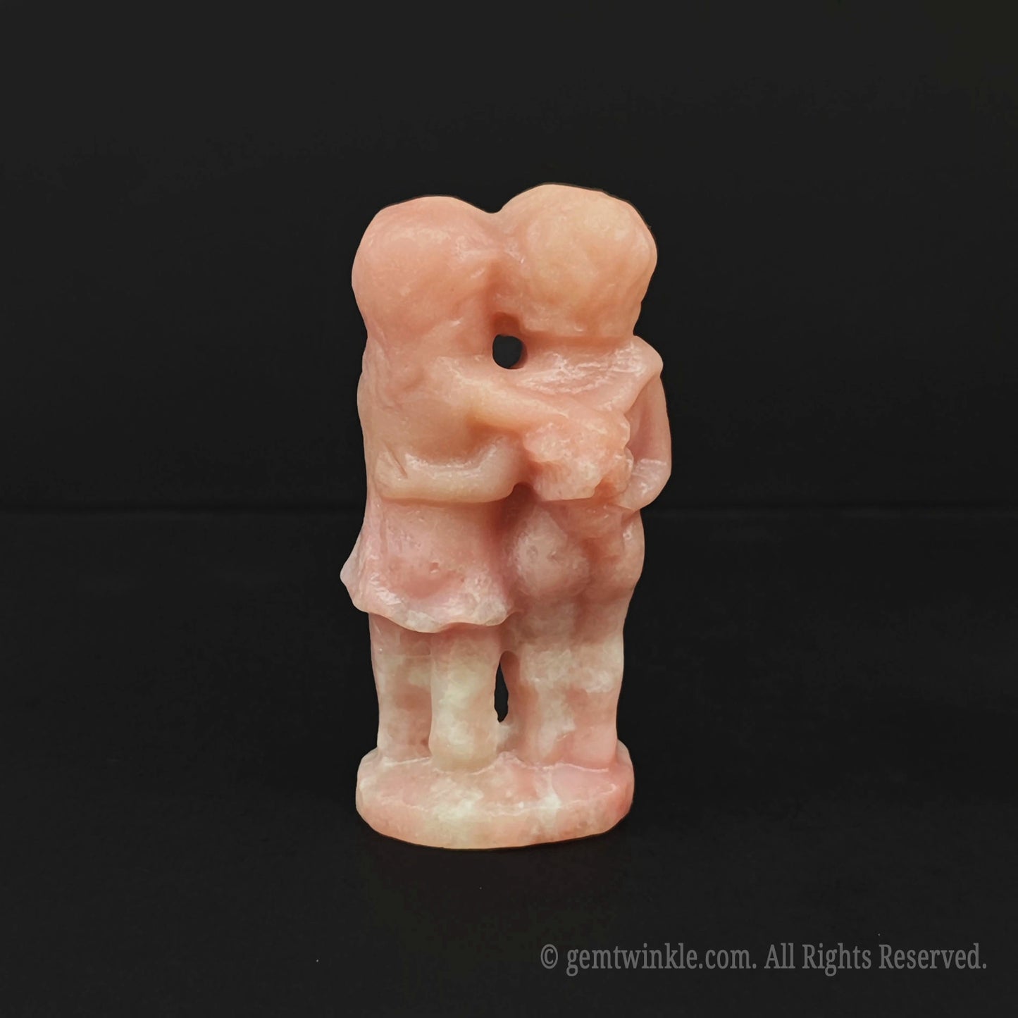 Back view of the hand sculpted pink opal young lovers figurine showing natural raw mineral lines