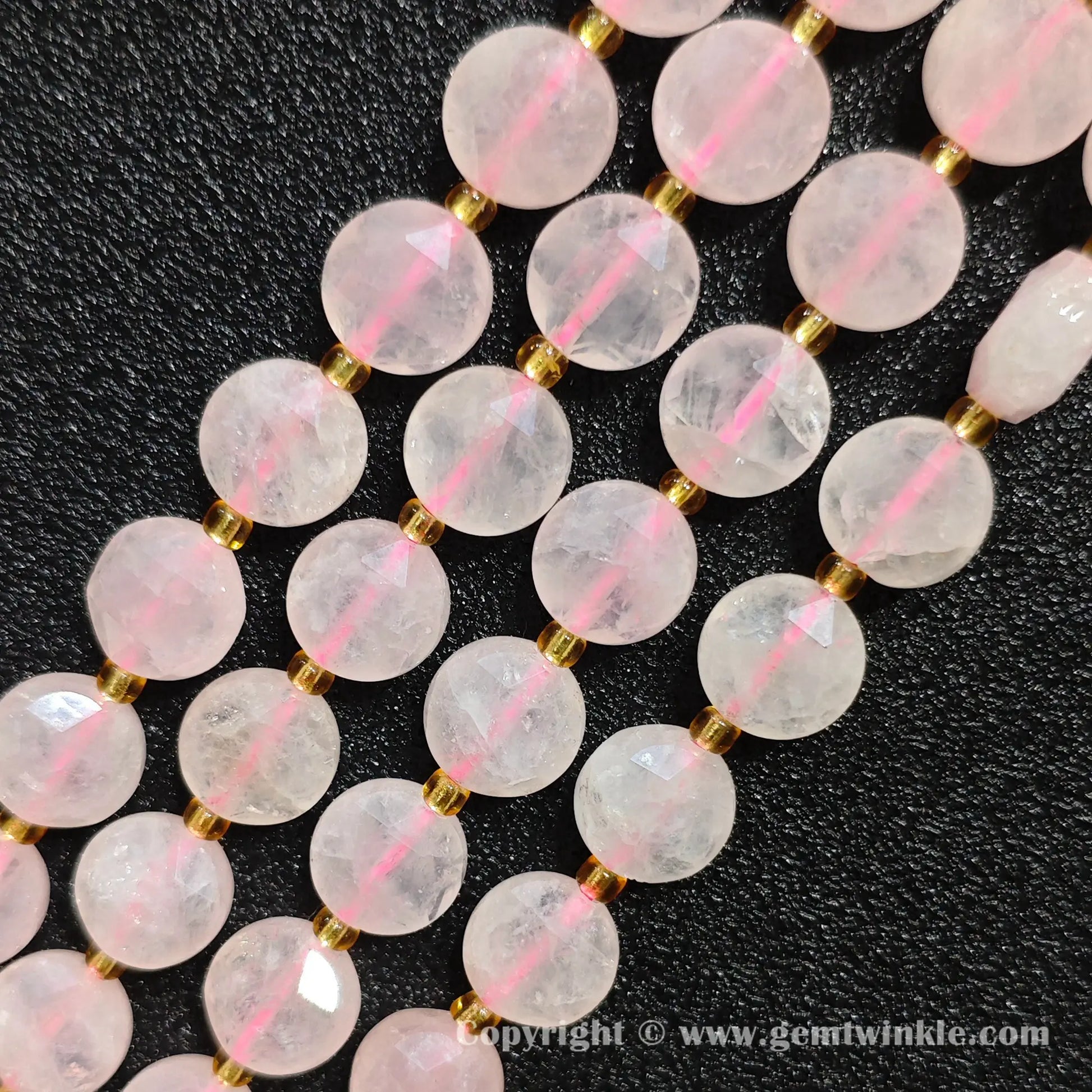 Close up preview of translucent pink rose quartz star faceted flat wheel beads