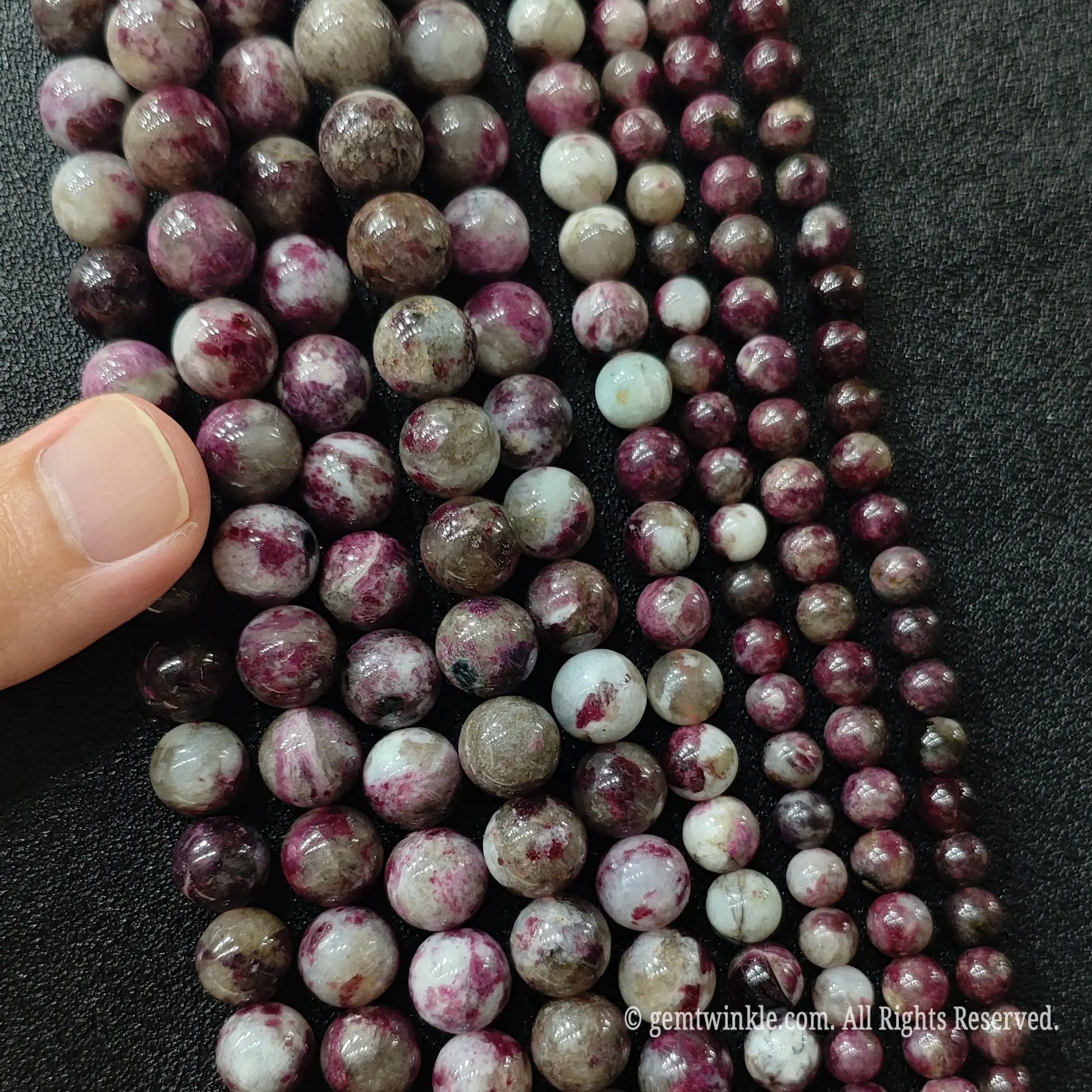 Plum blossom tourmaline round beads multiple size strands in 6mm 8mm and 10mm arranged side by side