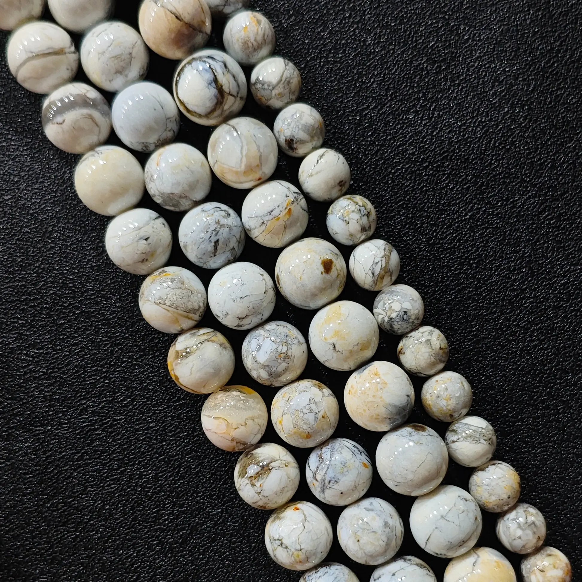 standard grade blue opal matrix polished round strands showcasing authentic earthy mineral texture lines
