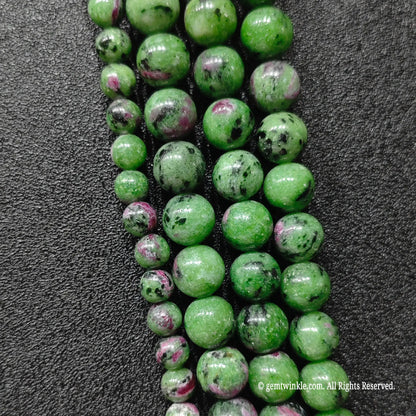 commercial grade ruby in zoisite polished round stone strands showcasing authentic mineral mosaic texture