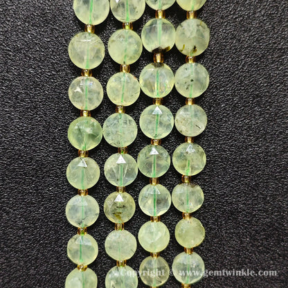 Side view of prehnite black tourmaline inclusion flat beads displaying bead thickness
