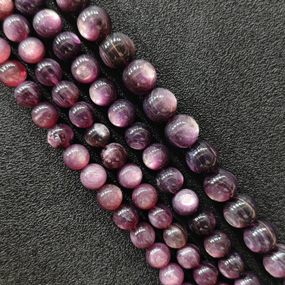 Purple lepidolite crystal beads strands showing shimmering lavender hues and layered mica textures