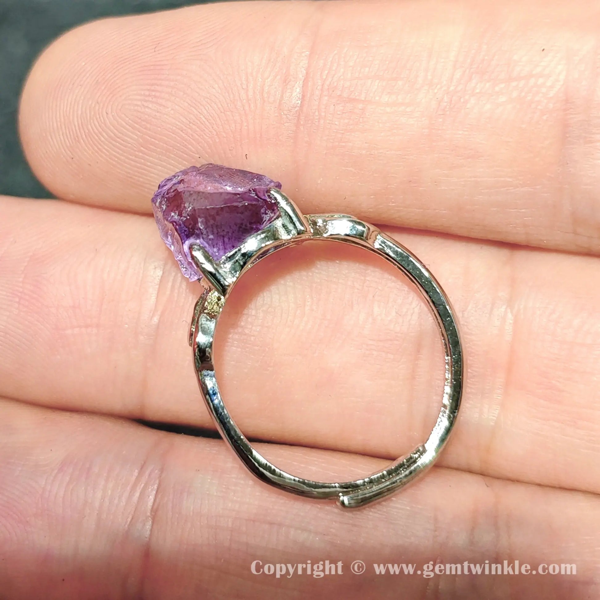 Handheld view of raw purple amethyst rough crystal adjustable metal alloy statement ring