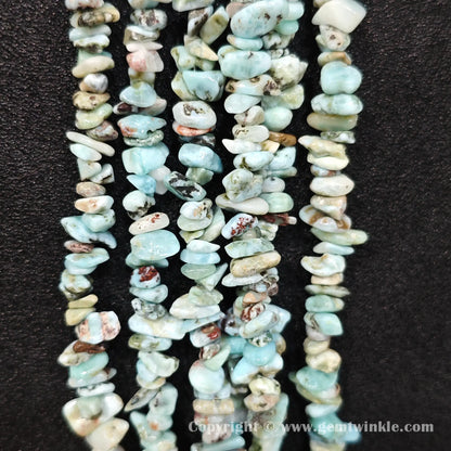 Vertical layout of raw blue larimar matrix chip beads showing sea foam patterns