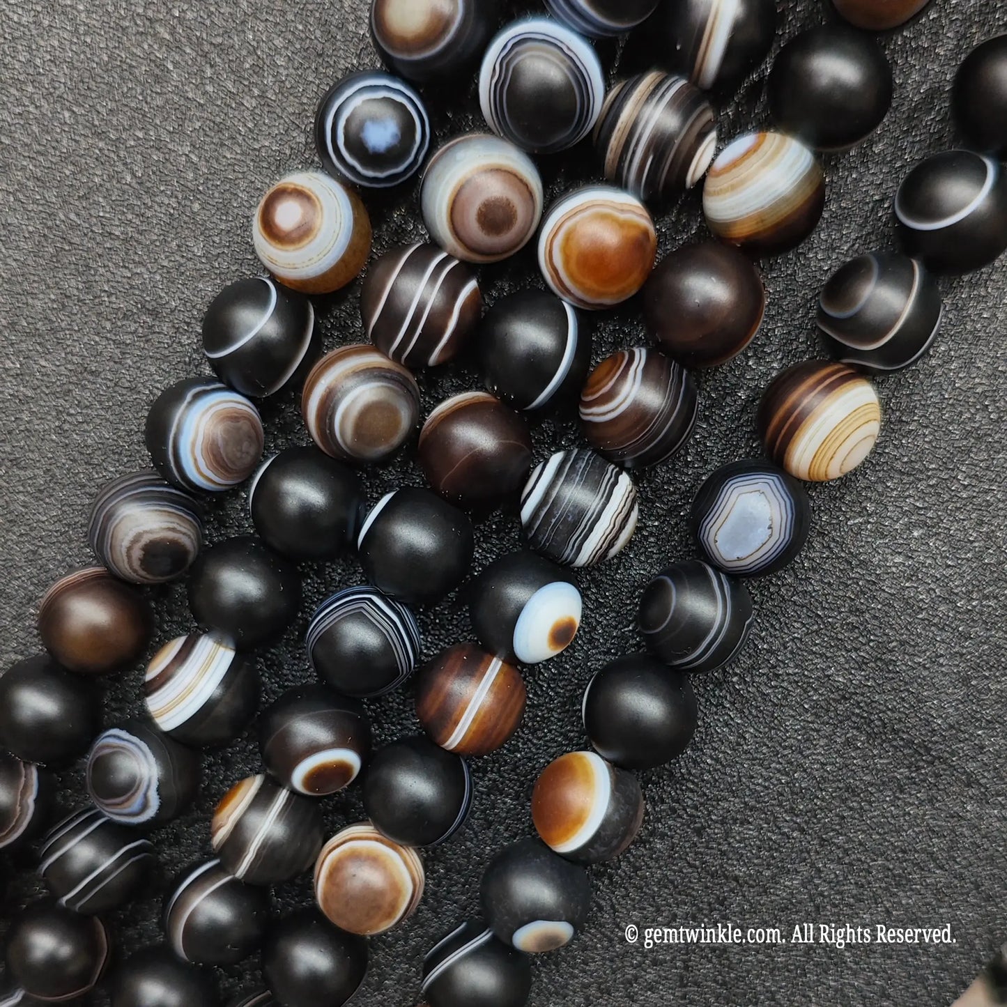 real crystal beads for jewelry making highlighting matte third eye agate loose strands with stark circular concentric bands