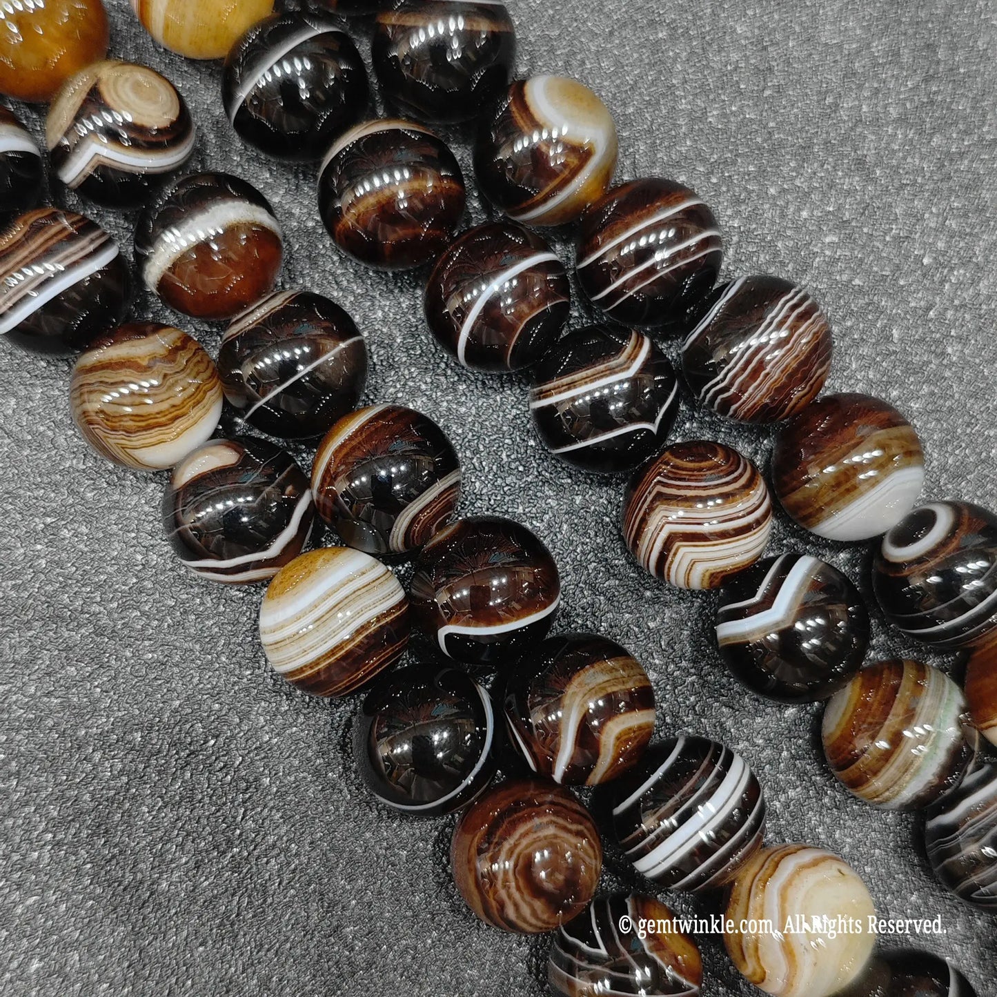 real crystal beads for jewelry making highlighting color enhanced grey sardonyx loose strands with sharp parallel white lines