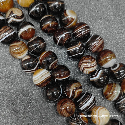 real crystal beads for jewelry making highlighting color enhanced grey sardonyx loose strands with sharp parallel white lines