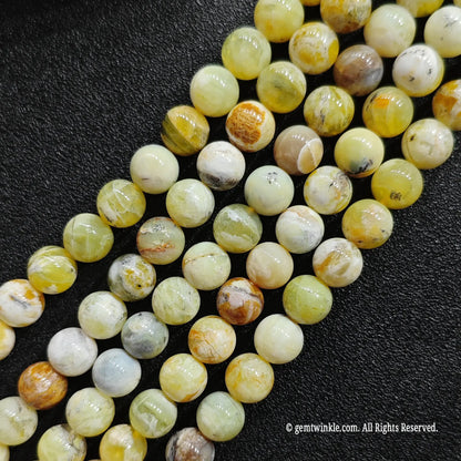 real crystal beads for jewelry making showcasing untreated honey yellow opal loose strands with natural brown markings