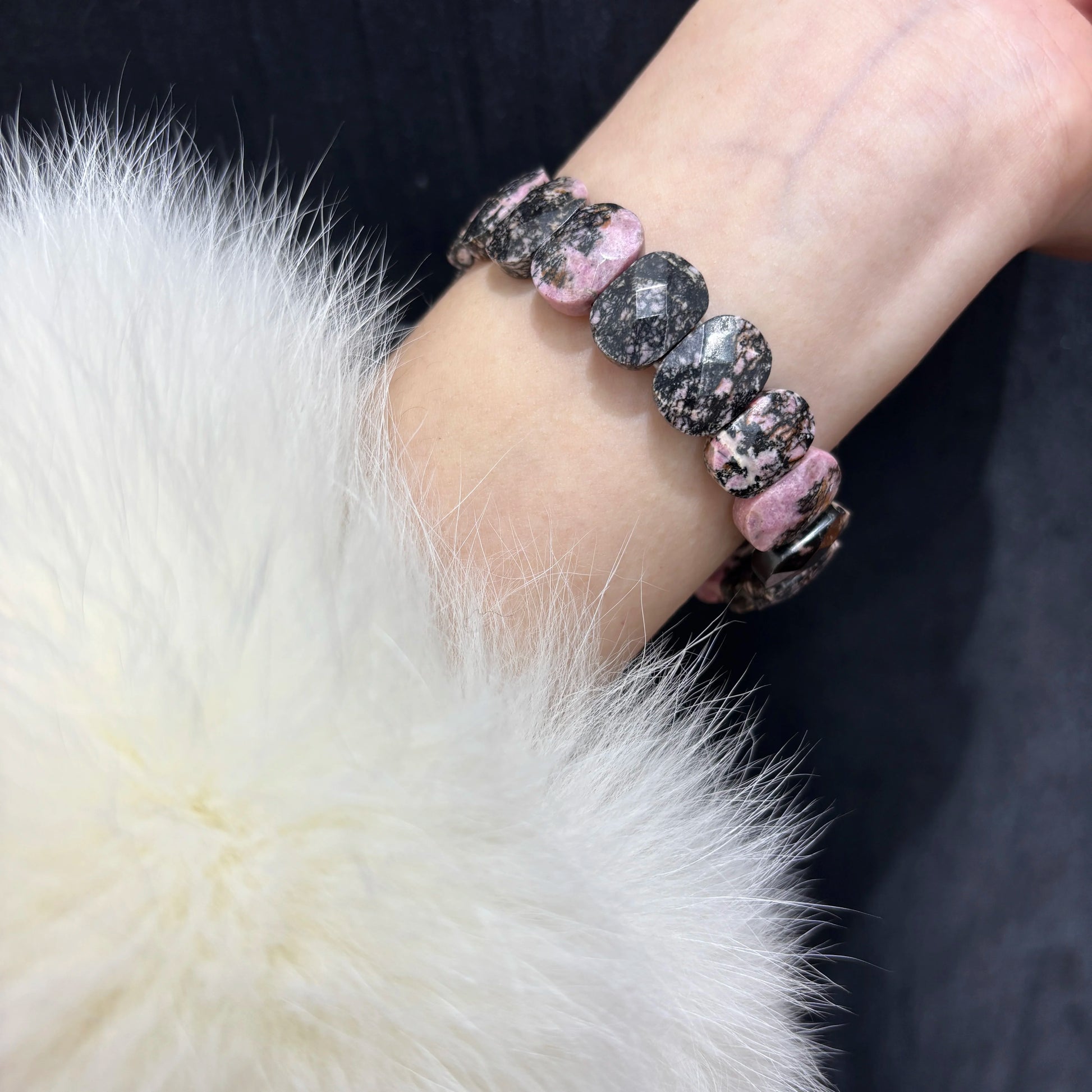Woman Wearing Natural Rhodonite Bangle Bracelet on Wrist - Stylish Boho Look
