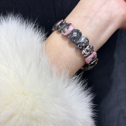 Woman Wearing Natural Rhodonite Bangle Bracelet on Wrist - Stylish Boho Look