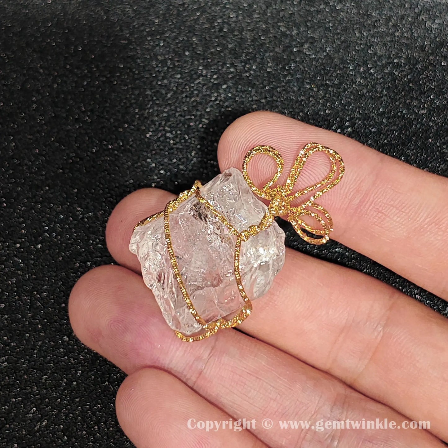 Close up view showing internal ice crackles and misty inclusions inside raw quartz stone