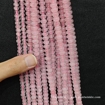 rose-quartz-smooth-disc-beads-hand-preview-close-up
