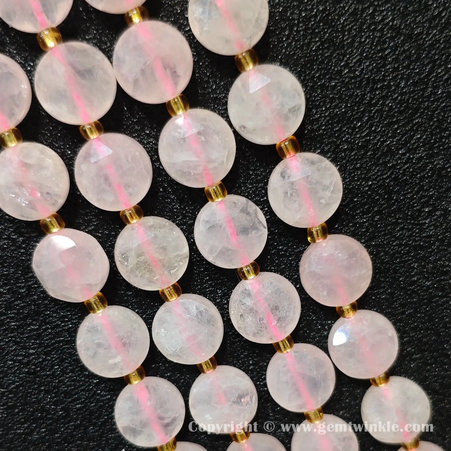 Side view of pastel pink rose quartz star cut flat disc beads showing edge thickness