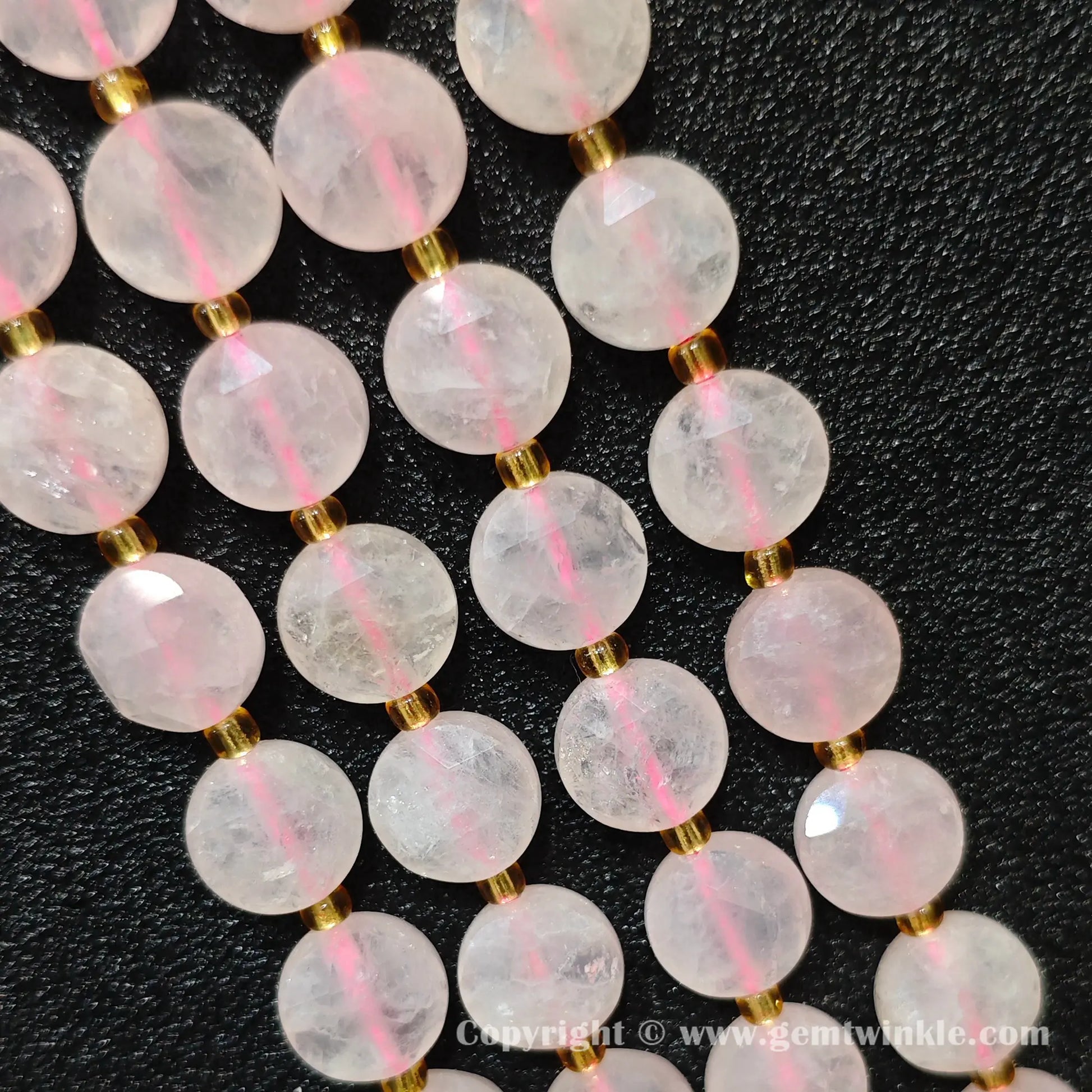 Side view of pastel pink rose quartz star cut flat disc beads showing edge thickness