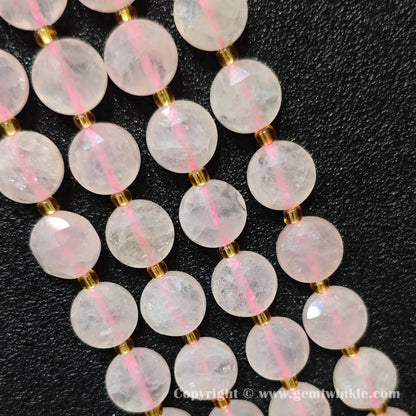 Side view of pastel pink rose quartz star cut flat disc beads showing edge thickness